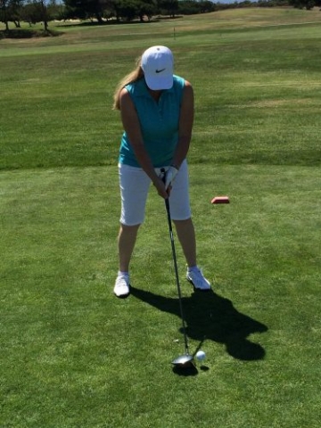 Lady golfer ready to hit the ball
