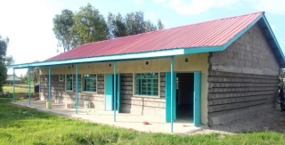 Doors and windows are installed. Now the front of the dormitory is partially painted.